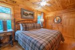 Upstairs Master Suite Features King Bed, Access to Private Screened In Deck, & Ensuite